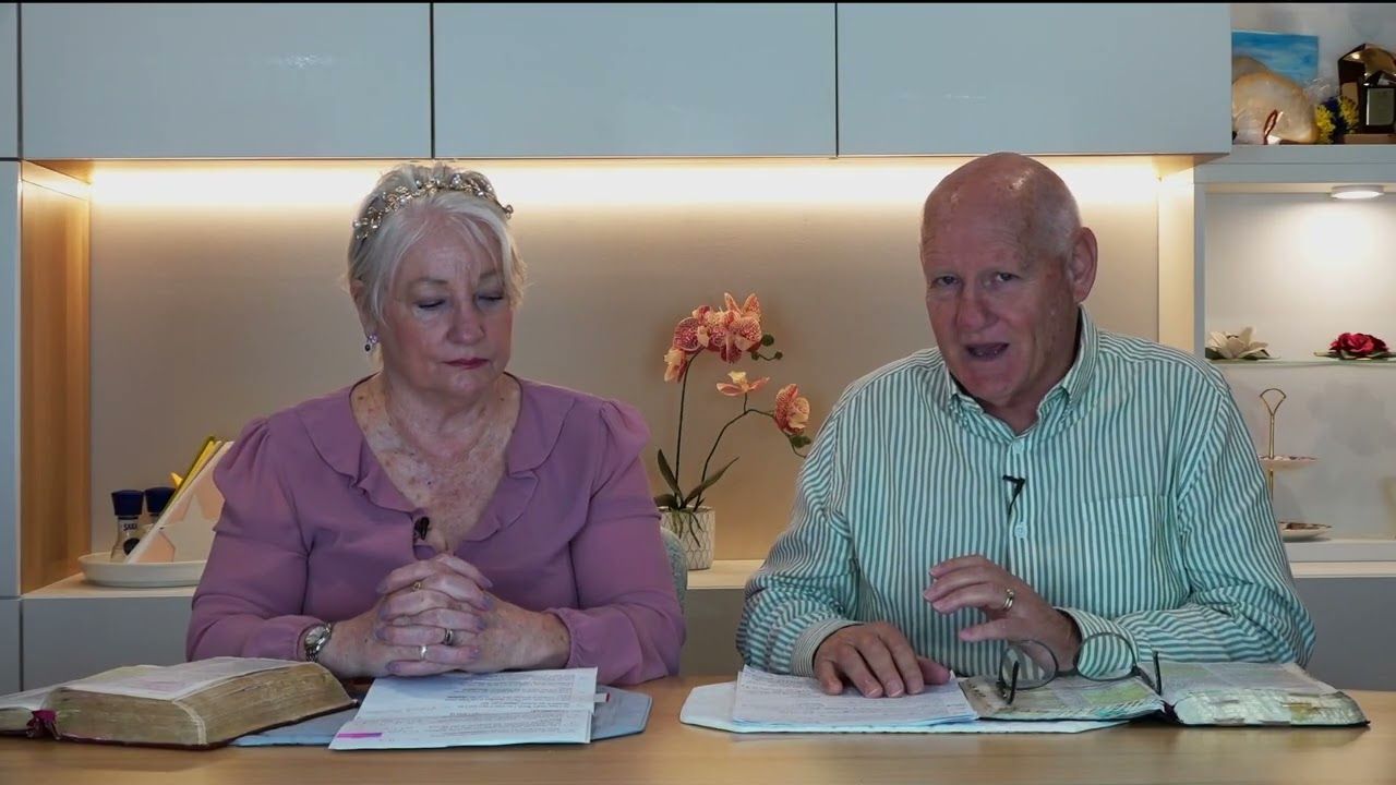 Shayne and Susan Cunningham sharing from the Bible at the Victory Bible Studies table
