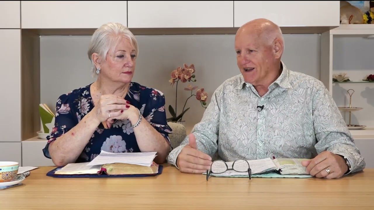 Shayne and Susan Cunningham at the study table with open Bibles for Victory Bible Studies